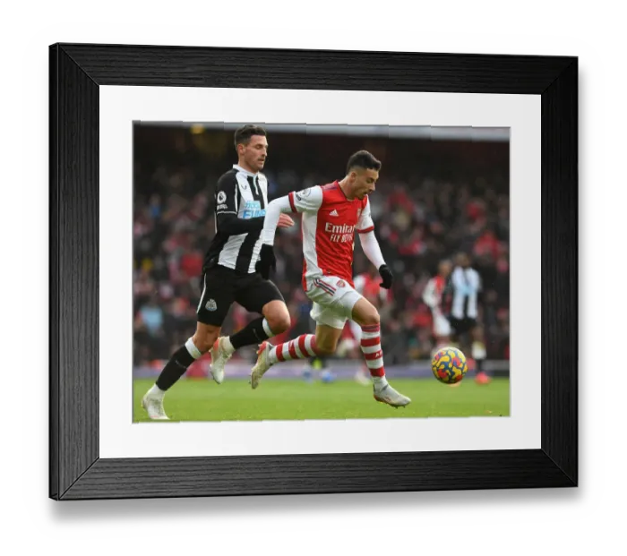 Framed Print : Martinelli vs. Schar: A Fierce Battle in Arsenal's Premier League Clash Against Newcastle Framed Print : Martinelli vs. Schar: A Fierce Battle in Arsenal's Premier League Clash Against Newcastle