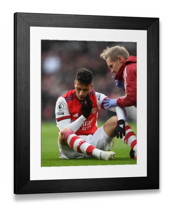 Framed Print : Arsenal's Gabriel Martinelli Receives Treatment vs Newcastle United (Premier League 2021-22) Framed Print : Arsenal's Gabriel Martinelli Receives Treatment vs Newcastle United (Premier League 2021-22)