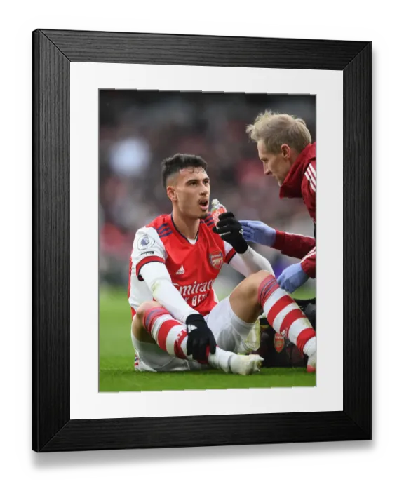 Framed Print : Arsenal's Gabriel Martinelli Receives Medical Attention During Arsenal vs Newcastle United (Premier League 2021-22) Framed Print : Arsenal's Gabriel Martinelli Receives Medical Attention During Arsenal vs Newcastle United (Premier League 2021-22)