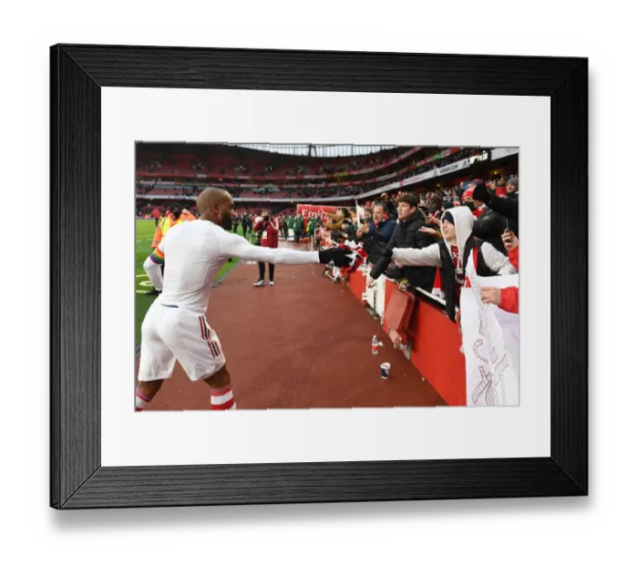 Framed Print : Arsenal's Alexandre Lacazette Greets Fan with Shirt after Arsenal v Newcastle United Match (2021-22) Framed Print : Arsenal's Alexandre Lacazette Greets Fan with Shirt after Arsenal v Newcastle United Match (2021-22)
