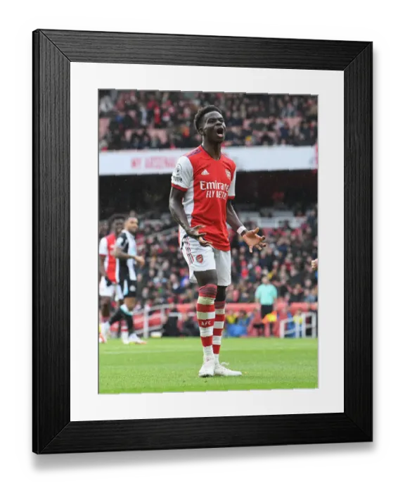 Framed Print : Arsenal's Bukayo Saka in Action Against Newcastle United - Premier League 2021-22 Framed Print : Arsenal's Bukayo Saka in Action Against Newcastle United - Premier League 2021-22