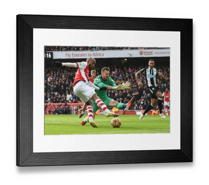 Framed Print : Lacazette vs Dubravka: A Premier League Battle at Emirates Stadium - Arsenal vs Newcastle United