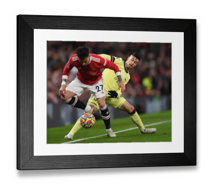 Framed Print : Martinelli vs. Telles: A Battle at Old Trafford - Premier League 2020-21: Arsenal's Martinelli Clashes with Man Utd's Telles