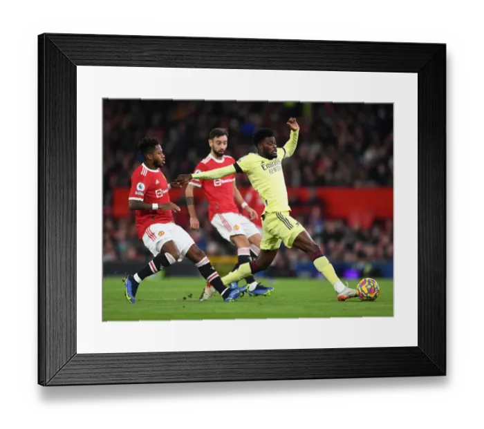 Framed Print : Thomas Partey vs Fred: Intense Battle in Manchester United vs Arsenal Premier League Clash Framed Print : Thomas Partey vs Fred: Intense Battle in Manchester United vs Arsenal Premier League Clash