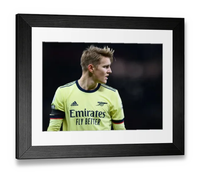 Framed Print : Arsenal's Odegaard Clashes with Manchester United in Premier League Showdown (2020-21) Framed Print : Arsenal's Odegaard Clashes with Manchester United in Premier League Showdown (2020-21)