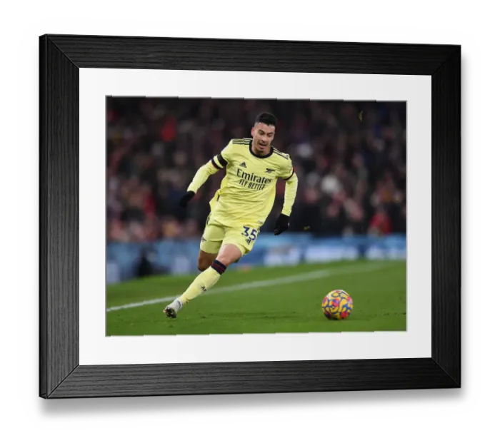 Framed Print : Arsenal's Gabriel Martinelli Faces Off Against Manchester United in Premier League Clash Framed Print : Arsenal's Gabriel Martinelli Faces Off Against Manchester United in Premier League Clash