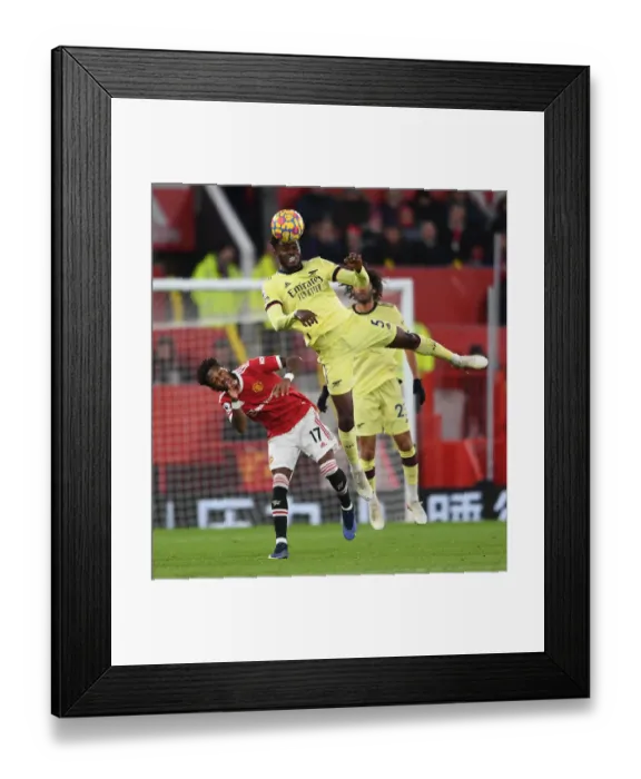 Framed Print : Partey vs. Fred: Intense Heading Battle at Old Trafford - Manchester United vs. Arsenal, Premier League 2020-21