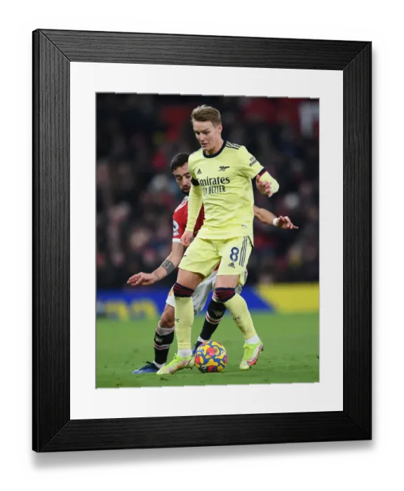 Framed Print : Arsenal's Martin Odegaard Faces Off Against Manchester United at Old Trafford (Manchester United vs Arsenal, Premier League 2020-21) Framed Print : Arsenal's Martin Odegaard Faces Off Against Manchester United at Old Trafford (Manchester United vs Arsenal, Premier League 2020-21)