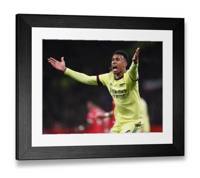 Framed Print : Gabriel Magalhaes Faces Off Against Manchester United in Premier League Clash