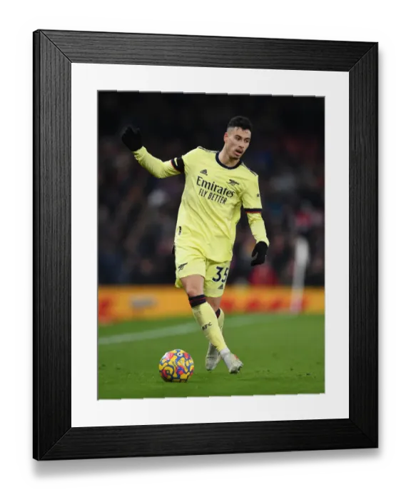 Framed Print : Gabriel Martinelli Faces Off Against Manchester United in Premier League Clash (2020-21) Framed Print : Gabriel Martinelli Faces Off Against Manchester United in Premier League Clash (2020-21)