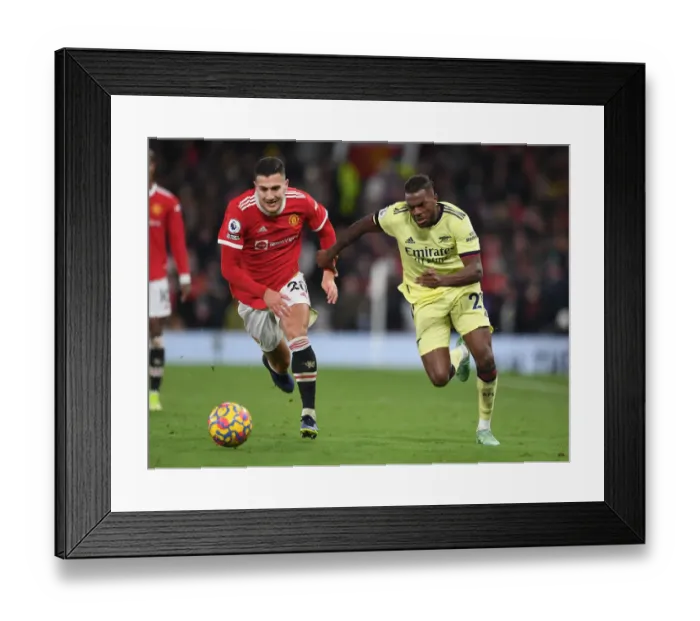 Framed Print : Nuno Tavares vs Diogo Dalot: A Clash at Old Trafford - Premier League 2020-21: Manchester United vs Arsenal