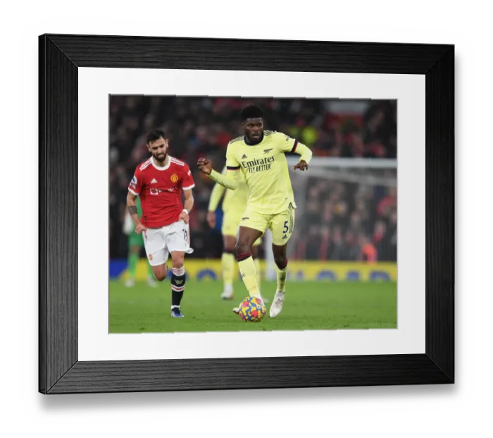 Framed Print : Thomas Partey Faces Off Against Manchester United in Premier League Clash