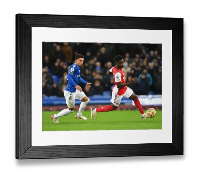 Framed Print : Clash at Goodison Park: Saka vs. Godfrey in Everton vs. Arsenal Premier League Showdown Framed Print : Clash at Goodison Park: Saka vs. Godfrey in Everton vs. Arsenal Premier League Showdown