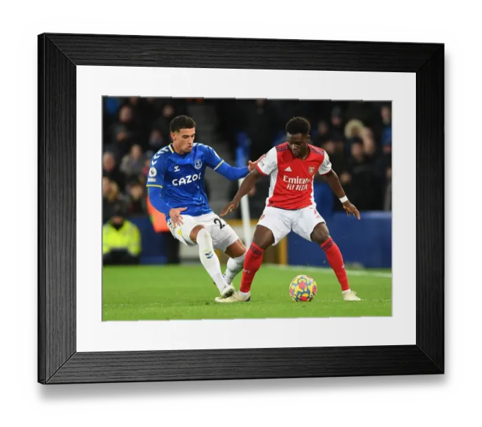 Framed Print : Clash at Goodison Park: Bukayo Saka vs Ben Godfrey in Everton vs Arsenal Premier League Showdown