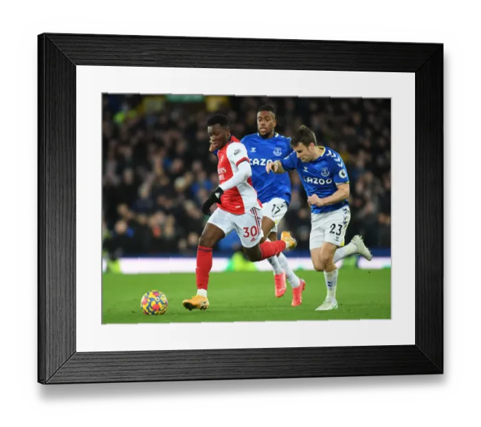 Framed Print : Arsenal's Eddie Nketiah Outmaneuvers Everton's Seamus Coleman in Premier League Clash