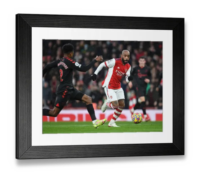 Framed Print : Arsenal's Alex Lacazette Outmaneuvers Southampton's Kyle Walker-Peters in Premier League Clash