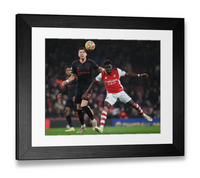 Framed Print : Arsenal vs. Southampton: Bukayo Saka vs. Jan Bednarek Battle at Emirates Stadium Framed Print : Arsenal vs. Southampton: Bukayo Saka vs. Jan Bednarek Battle at Emirates Stadium