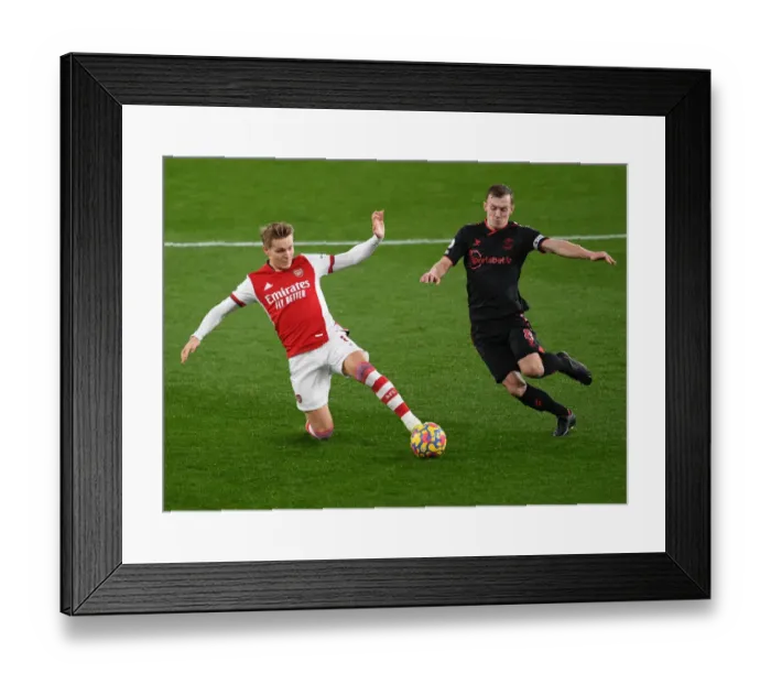 Framed Print : Arsenal vs Southampton: Martin Odegaard and James Ward-Prowse Clash in Premier League Showdown