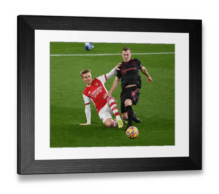 Framed Print : Odegaard vs. Ward-Prowse: A Premier League Showdown at Emirates Stadium - Arsenal vs. Southampton, 2021-22