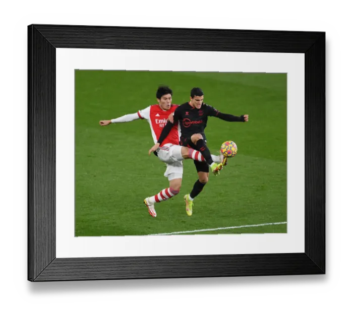 Framed Print : Arsenal vs Southampton: Tomiyasu vs Elyounoussi Clash in Premier League Showdown