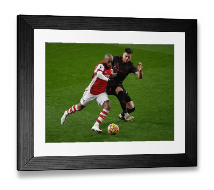 Framed Print : Arsenal vs. Southampton: Lacazette Faces Off Against Bednarek in Premier League Clash