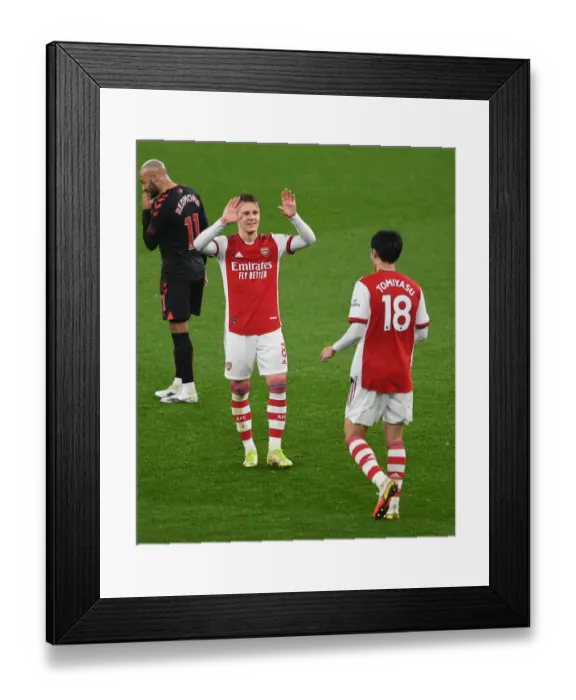 Framed Print : Arsenal: Odegaard and Tomiyasu Celebrate Victory Over Southampton (Premier League 2021-22)