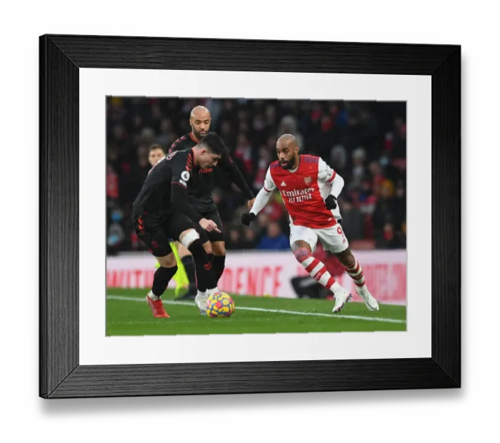 Framed Print : Arsenal's Lacazette Faces Off Against Southampton's Livermore in Premier League Clash
