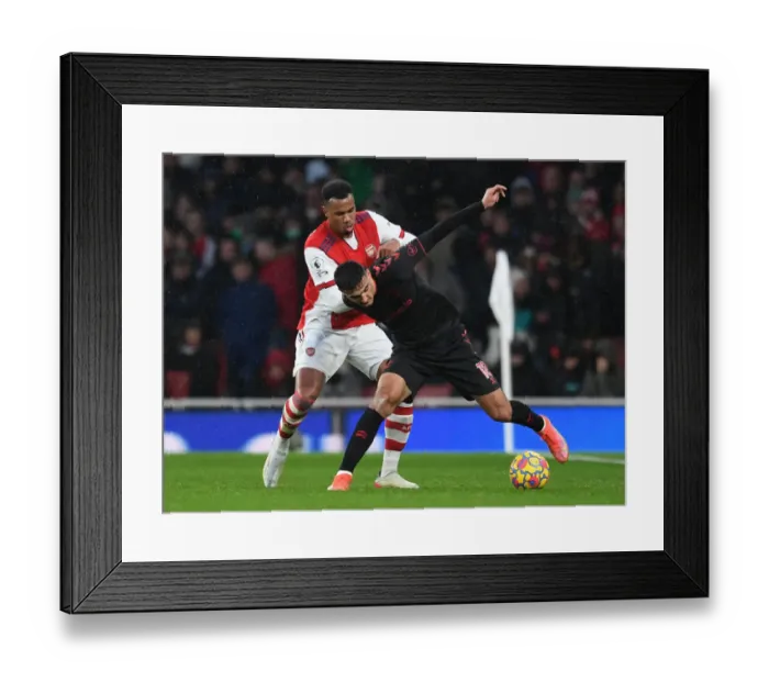 Framed Print : Arsenal vs. Southampton: Gabriel Magalhaes Faces Off Against Armando Broja in Premier League Clash