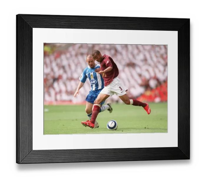 Framed Print : Ashley Cole (Arsenal) David Thompson (Wigan). Arsenal 4: 2 Wigan Athletic Framed Print : Ashley Cole (Arsenal) David Thompson (Wigan). Arsenal 4: 2 Wigan Athletic