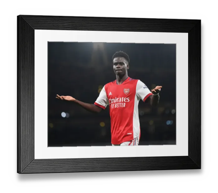 Framed Print : Arsenal's Bukayo Saka Shines in Premier League Clash Against West Ham United