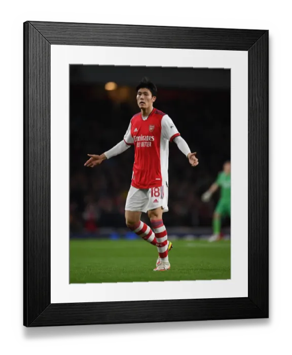 Framed Print : Arsenal's Tomiyasu in Action Against West Ham in Premier League Showdown Framed Print : Arsenal's Tomiyasu in Action Against West Ham in Premier League Showdown