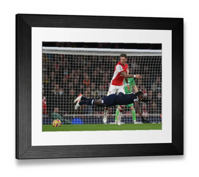 Framed Print : Arsenal vs. West Ham: Intense Clash at Emirates Stadium Framed Print : Arsenal vs. West Ham: Intense Clash at Emirates Stadium