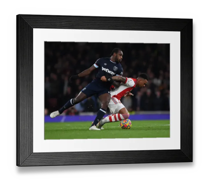 Framed Print : Arsenal vs. West Ham: Gabriel vs. Antonio - Intense Battle in the Premier League Framed Print : Arsenal vs. West Ham: Gabriel vs. Antonio - Intense Battle in the Premier League