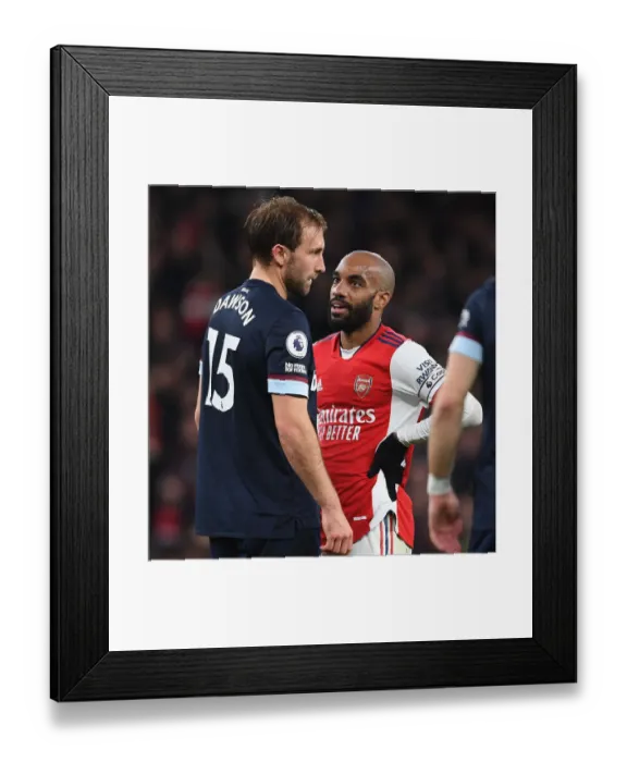 Framed Print : Arsenal vs. West Ham United: Lacazette and Dawson Clash in Premier League Showdown