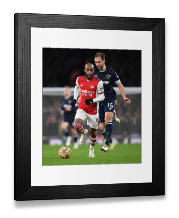 Framed Print : Arsenal's Lacazette Scores Past West Ham's Dawson in Premier League Clash