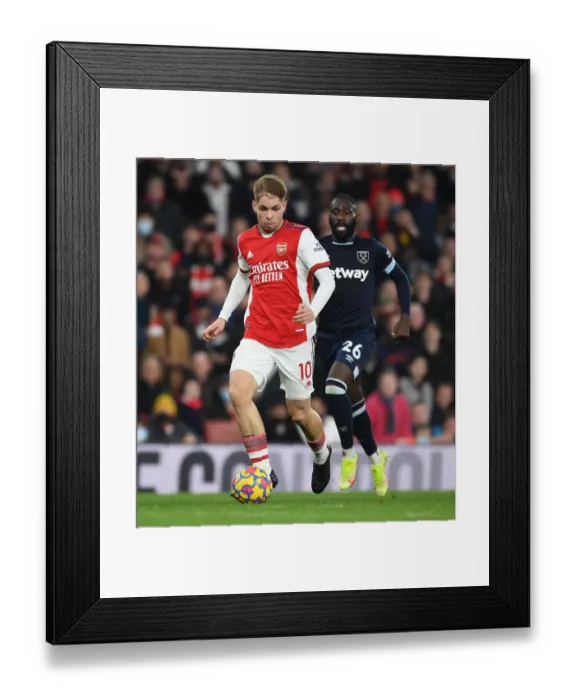 Framed Print : Emile Smith Rowe's Slick Moves: Outwitting Masuaku in Arsenal's Premier League Victory
