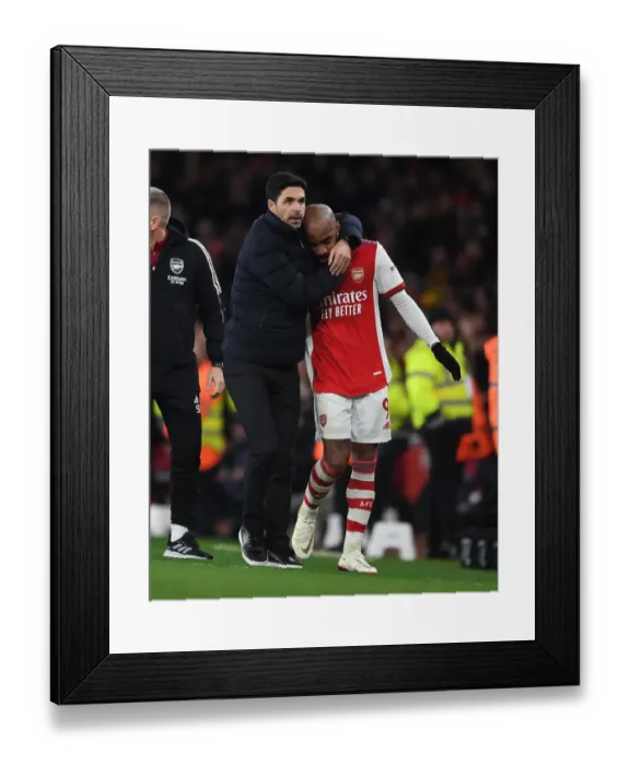 Framed Print : Mikel Arteta Consoles Emotional Alexis Lacazette: A Heartfelt Moment at Arsenal vs West Ham United