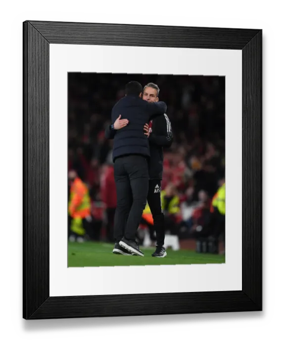 Framed Print : Arsenal's Mikel Arteta Embraces Assistant Coach Albert Stuivenburg After Arsenal v West Ham United Win Framed Print : Arsenal's Mikel Arteta Embraces Assistant Coach Albert Stuivenburg After Arsenal v West Ham United Win
