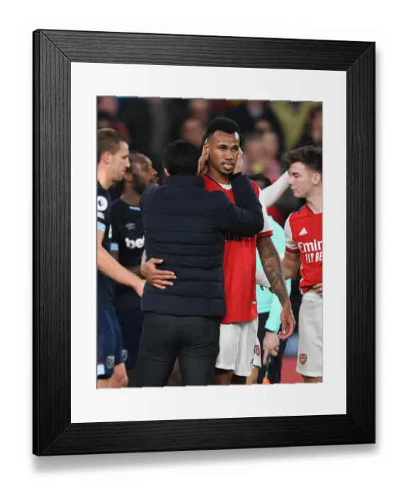Framed Print : Arsenal's Victory: Mikel Arteta Consoles Gabriel after Arsenal v West Ham United (2021-22)