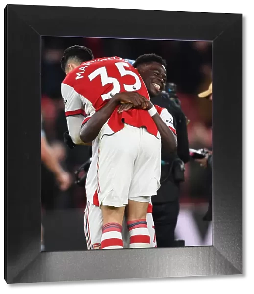 Arsenal Celebrate Victory: Martinelli and Saka Rejoice After Arsenal v West Ham United (2021-22)