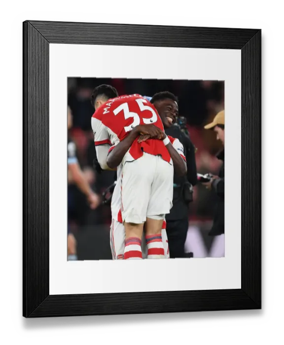Framed Print : Arsenal Celebrate Victory: Martinelli and Saka Rejoice After Arsenal v West Ham United (2021-22)