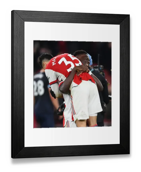 Framed Print : Arsenal's Martinelli and Saka Celebrate Goal: Arsenal v West Ham United, Premier League 2021-22