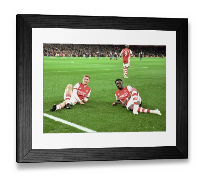 Framed Print : Arsenal's Smith Rowe and Saka Celebrate Goals Against West Ham in Premier League Clash