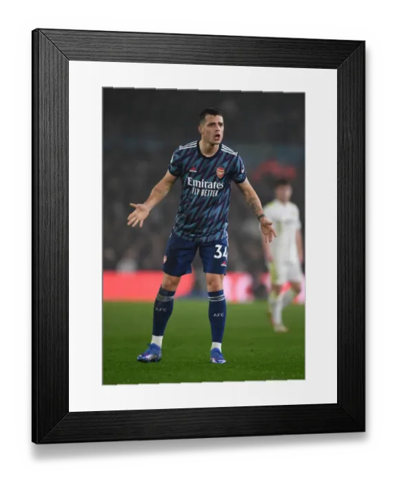 Framed Print : Granit Xhaka's Brilliant Midfield Performance: Arsenal Triumphs Over Leeds United, Premier League 2021-22