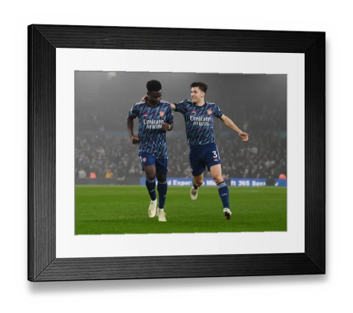 Framed Print : Saka and Tierney Celebrate Arsenal's Triumph Over Leeds United (2021-22) Framed Print : Saka and Tierney Celebrate Arsenal's Triumph Over Leeds United (2021-22)