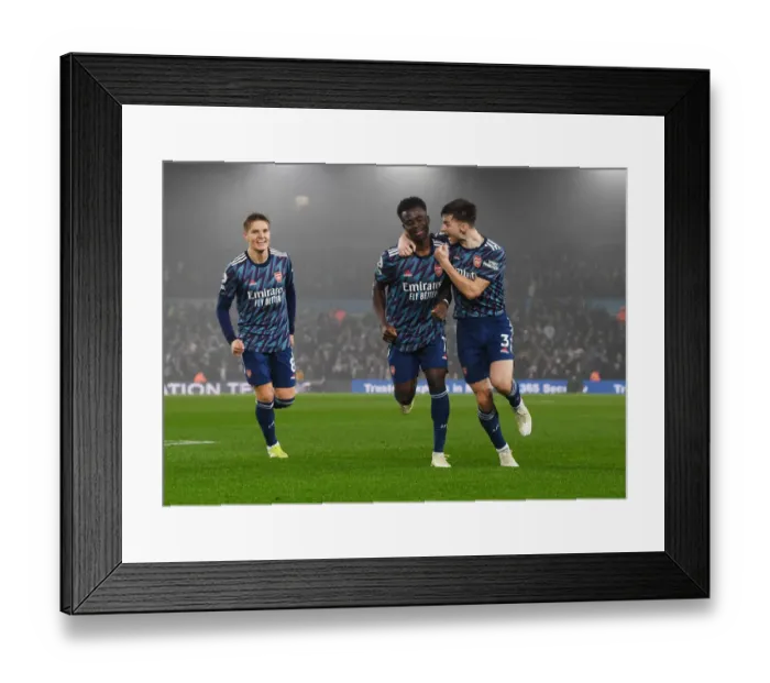 Framed Print : Saka and Tierney Celebrate Arsenal's Third Goal vs Leeds United (2021-22)