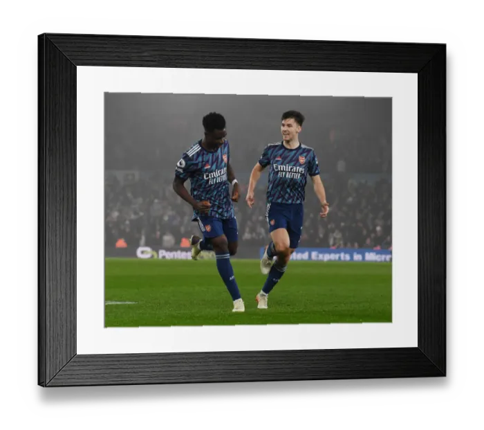 Framed Print : Arsenal's Saka and Tierney: Celebrating the Third Goal Against Leeds United (2021-22)