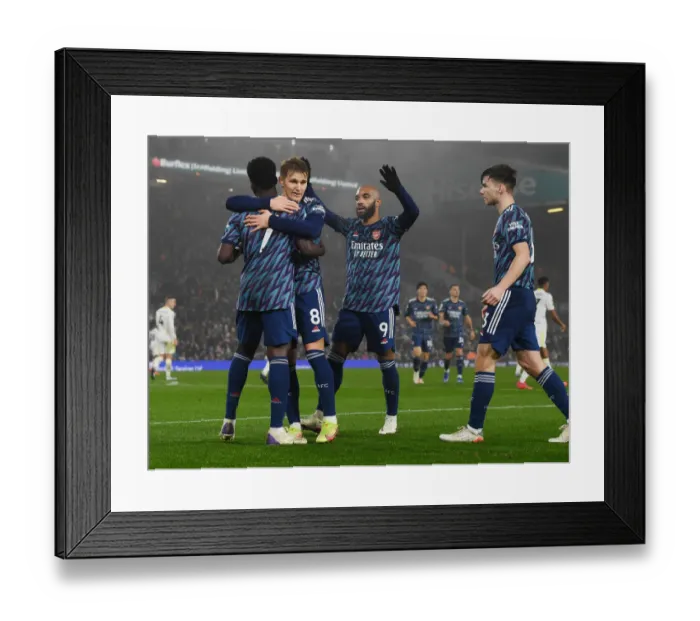 Framed Print : Arsenal's Bukayo Saka, Odegaard, Lacazette, and Tierney Celebrate Goals Against Leeds United (December 2021)