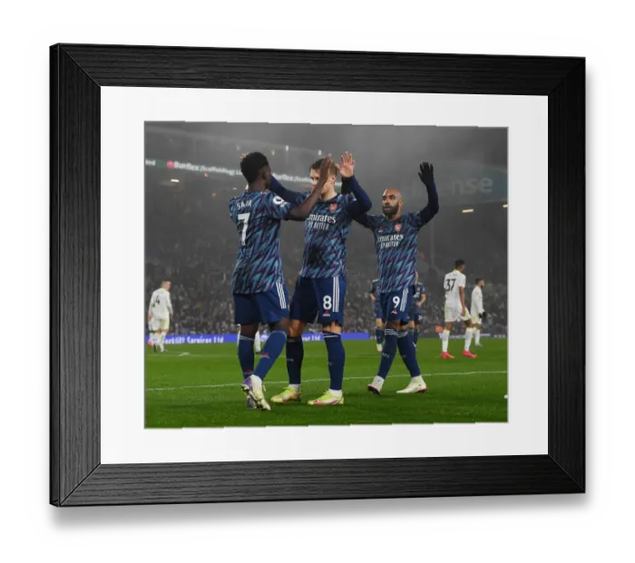 Framed Print : Arsenal's Saka, Odegaard, and Lacazette: Celebrating Goals Against Leeds United (December 2021)