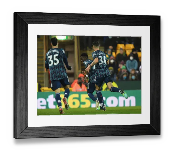 Framed Print : Arsenal's Triumph: Saka and Xhaka's Goal Celebration vs Norwich City (December 2021)
